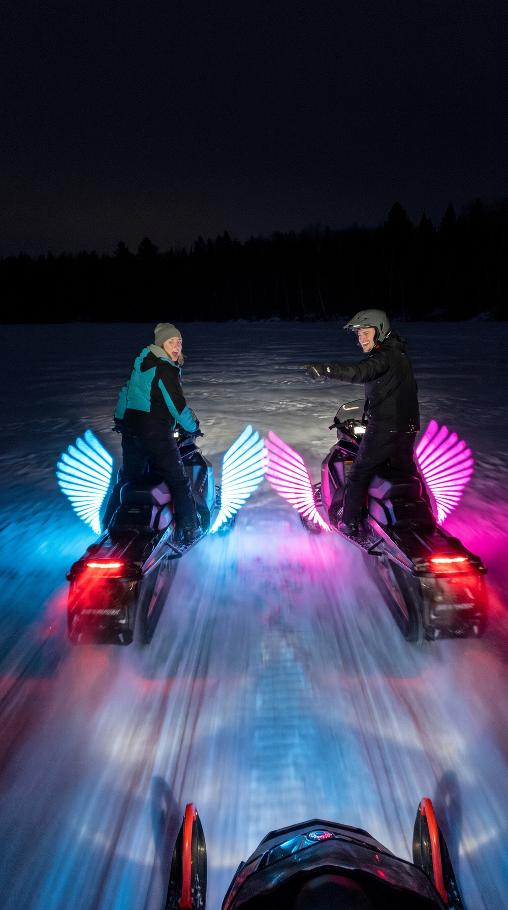 Snowmobile on a snowy trail with glowing ice-blue angel wings